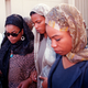 Three of the daughters of Betty Shabazz enter the Islamic Cultural Center in New York for private funeral services 27 June, 1997. Shabazz, the widow of slain black leader Malcolm X, died 23 June of burns suffered when her apartment was set ablaze, allegedly by her grandson Malcolm Shabazz. Left to right, are Malikah, Malaak and Qubilah Shabazz.